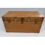 A camphor wood campaign trunk with shaped brass bindings, width 106.5cm, height 54cm, depth 59cm.