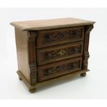 A miniature oak chest of drawers, early 20th century, with three long drawers, height 24.