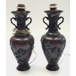 A pair of Japanese bronze vases, 19th century, converted to lamps and drilled for electricity,