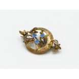A Victorian 9ct gold and enamel aesthetic movement brooch, hallmark 1889.