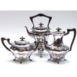 An Edwardian spirit kettle, a matching coffee pot and matching tea pot.