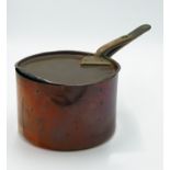 A Victorian copper saucepan and cover, height 15cm, total length 42cm,