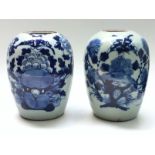 A pair of Japanese porcelain blue and white jars, 19th century, each lacking covers, height 29cm.