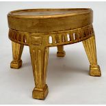 A gilt wood circular stand, early 20th century, with arcaded frieze and fluted square legs,