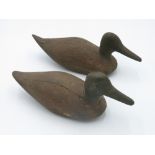 A naive pine duck decoy, 20th century, 34cm, and another similar.