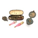 A set of bronze nesting weights, a similar set, a cased scale and two cheroot holders,
