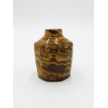 An agate glazed pottery tea caddy, early 19th century, height 11cm.