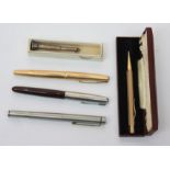 A gold plated Parker 61 fountain pen, a brown Parker fountain pen with stainless steel cap,