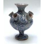 A Continental faience tulip holder, probably 19th century, blue painted with flowers and cherubs,