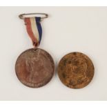 Two commemorative medals.