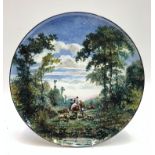 A French Gien pottery charger, 20th century, signed Gauffre, painted with figures,