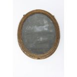 An 18th century gilt framed oval wall mirror, 49 x 37cm.