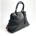 A Prada black leather handbag,