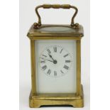 A French brass cased carriage clock, white enamel dial, stamped G.H.