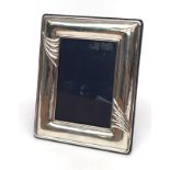 A modern silver photograph frame.