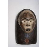 An African wooden Yombe tribal mask, Congo, height 32cm width 22.5cm.