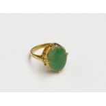 A Chinese high purity gold jade set ring.