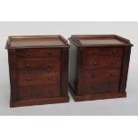 A pair of Victorian mahogany miniature Wellington chests, each with four long graduated drawers,