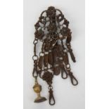 An early 19th Berlin cut steel chatelaine with five spring clips,