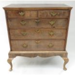 A Georgian walnut chest on stand,