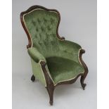 A Victorian mahogany upholstered gentleman's armchair, with padded back,