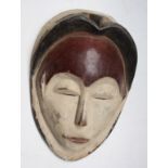 An African wooden Tsogo tribal mask, Gabon, height 34cm, width 23cm.