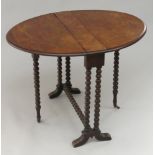 A Victorian burr walnut Sutherland table, the oval top on bobbin turned legs, height 59cm,