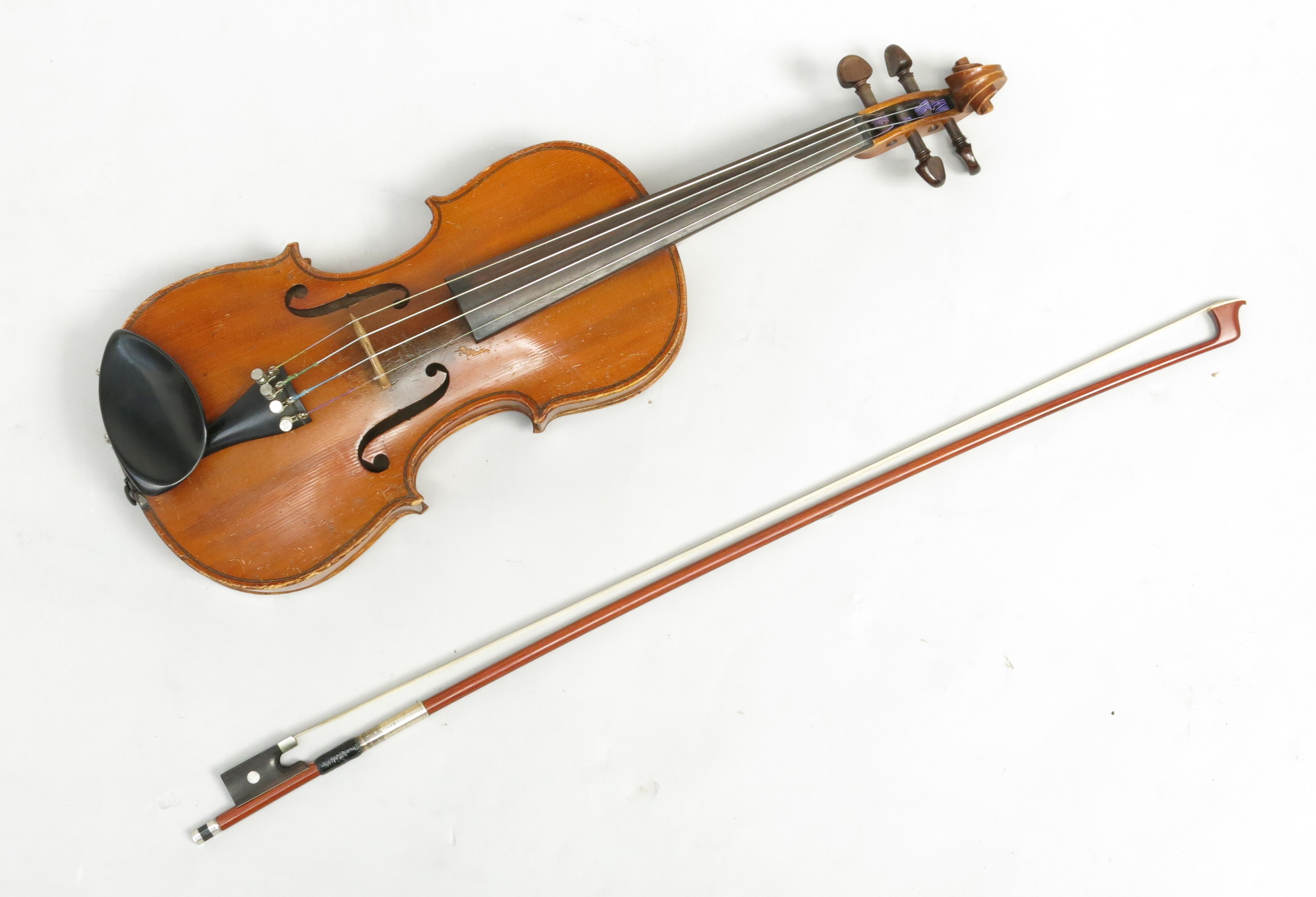A 3/4 size violin, Stradivarius copy, with figured two-piece back, length of back 33.