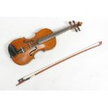 A 3/4 size violin, Stradivarius copy, with figured two-piece back, length of back 33.