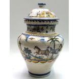 A Spanish Majolica vase and cover, 20th century, painted with huntsman, buildings and bulls,