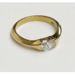 An 18ct gold post-war ring set with an oval diamond of approximately 0.5cts spread.