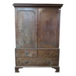 A George III mahogany linen press, with a pair of panelled doors,