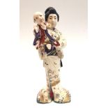 A Japanese Satsuma figure of a mother and child, height 29cm.
