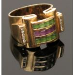 An 18ct gold 1950's styled ring with bands of amethyst and green stones between diamond line