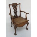 A Georgian mahogany armchair commode, height 110cm, width 62cm.