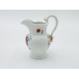 A Victorian bone china jug, with gadrooned border and moulded and floral painted decoration,