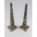 A pair of stone obelisks of typical tapered form, on stepped bases, height 35.