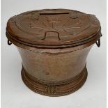 A large Dutch copper circular bin and hinged cover, 19th century, embossed with a stylised tulip,