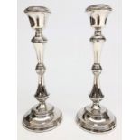 A pair of post war filled silver candlesticks by W I Broadway & Co, Birmingham. Height 30cm.