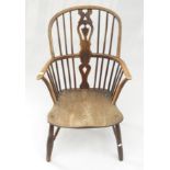An ash and elm Windsor armchair, with a pierced vertical splat and stick filled back, height 94cm.