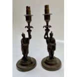 A pair of Continental bronze figural candlesticks, 19th century, height 24cm.