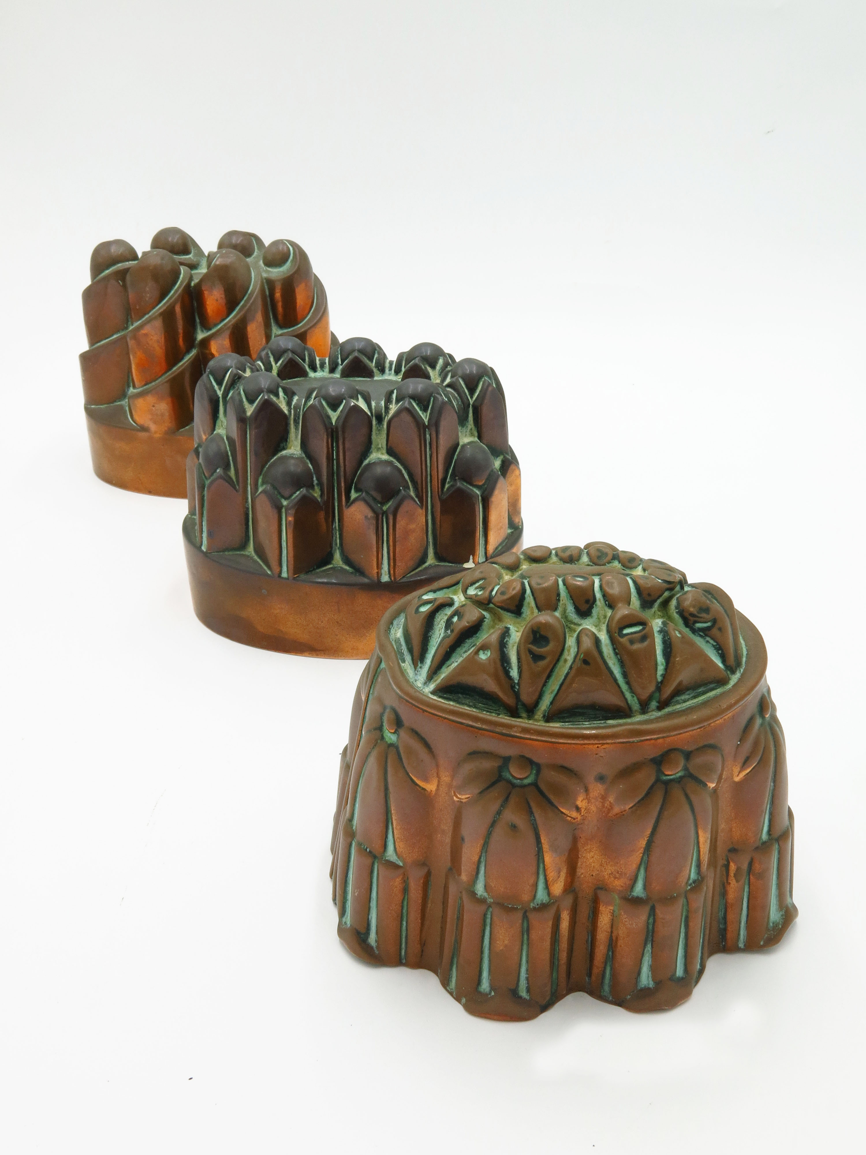 A Victorian copper jelly mould, by Benham and Froud, with vertical turret design,