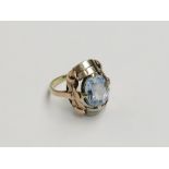 A 14ct gold two colour ring set an aquamarine of approximately 5 carats.