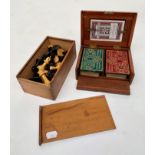 A late Victorian mahogany cased Bezique set, width 16cm, together with a turned wood chess set.