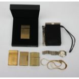 A ladies Raymond Weil wristwatch, an Yves St Laurent cigarette holder, two Dupont lighters,