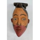 An African wooden Bakongo tribal polychrome mask, Congo, height 35cm width 21cm.