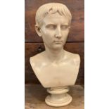A heavy resin bust of a Roman senator on circular socle base, height 52cm.