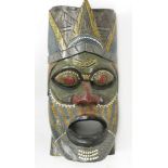 A large wall mask, possibly Australian, 20th century, with dot painted decoration, height 62cm.