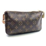 A Louis Vuitton monogram clutch handbag, cow hide leather handle, canvas lined interior,