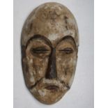 An African wooden Igbo tribal spirit mask, Nigeria, height 28cm width 16cm.